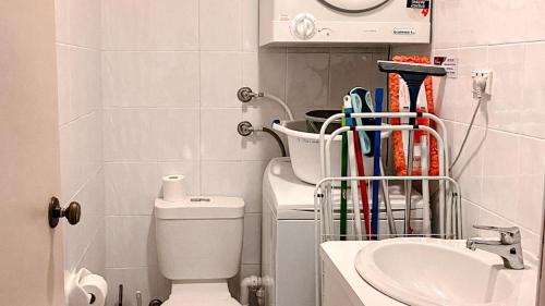 a bathroom with a toilet and a sink at Del Rae Unit 8 25 Shoal Bay Road in Shoal Bay