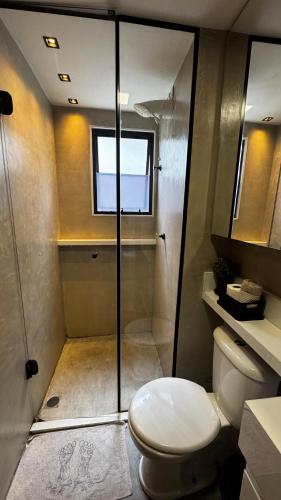 a bathroom with a toilet and a shower at Standard Garden 02 in Caruaru