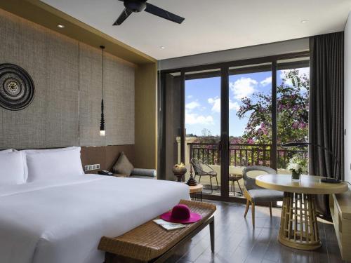 Postel nebo postele na pokoji v ubytování Pullman Resort Xishuangbanna