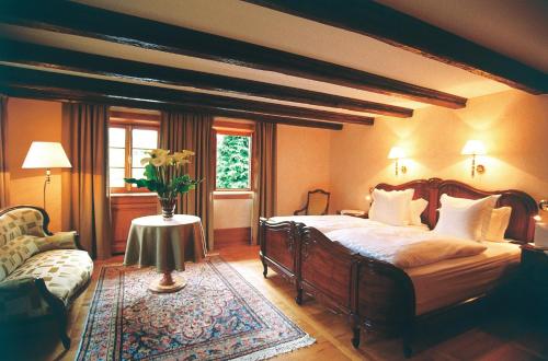 A bed or beds in a room at Hôtel à la Ferme