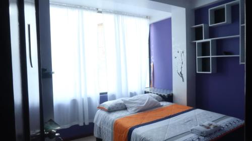 Ein Bett oder Betten in einem Zimmer der Unterkunft Centro Macas