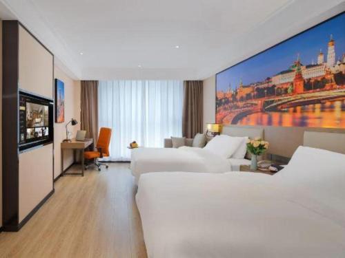 a hotel room with two beds and a large painting at Vienna Hotel Tianjin Jinzhong Street in Tianjin