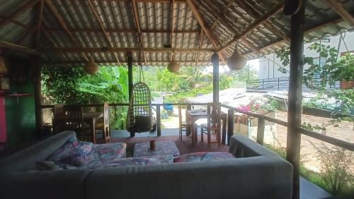 a living room with a couch and a table at Freedom camp & cafe ella in Ella