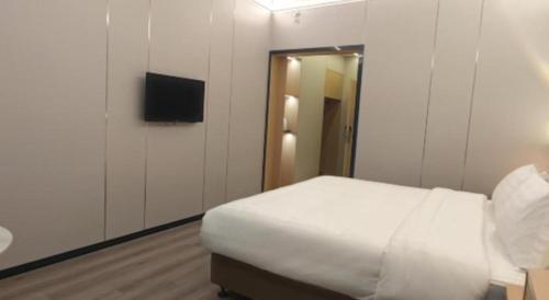 Katil atau katil-katil dalam bilik di Zhenxing Hotel