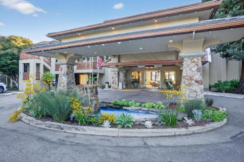 a building with a fountain in front of it at Luxury Ocean View Condo - Heated pool and Spa condo in La Selva Beach