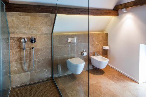 a bathroom with a shower with a toilet and a sink at Loblocher Hof in Neustadt an der Weinstraße