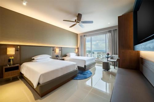 Un ou plusieurs lits dans un hébergement de l'établissement Hyatt Regency Cartagena
