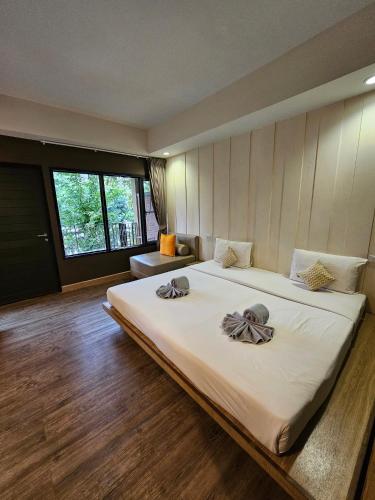 Postel nebo postele na pokoji v ubytování Samed Hideaway Resort