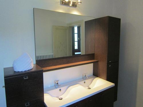 a bathroom with a sink and a large mirror at Luxury Castle, Basse-Bodeux in Basse-Bodeux