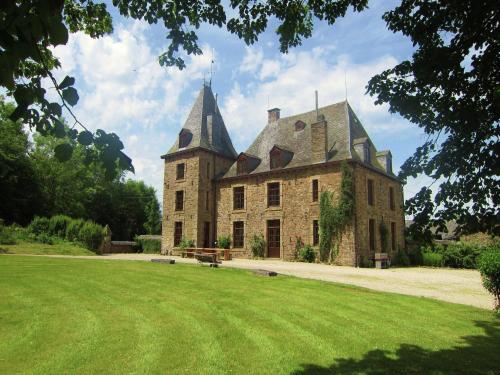 a large castle with two towers on a grass field at Luxury Castle, Basse-Bodeux in Basse-Bodeux
