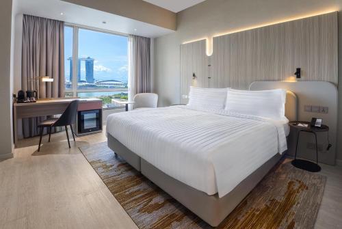 En eller flere senge i et værelse på Wyndham Singapore Hotel