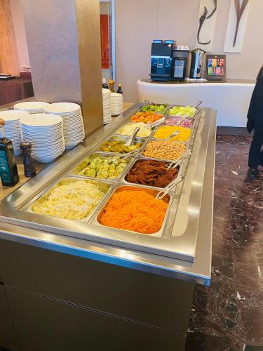 a buffet line with many different types of food at Hotel La Perla Del Golfo in Procchio