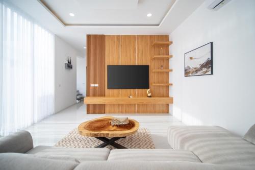 a living room with a couch and a table at Luxury Tropical Villa Samui - Shira in Koh Samui 