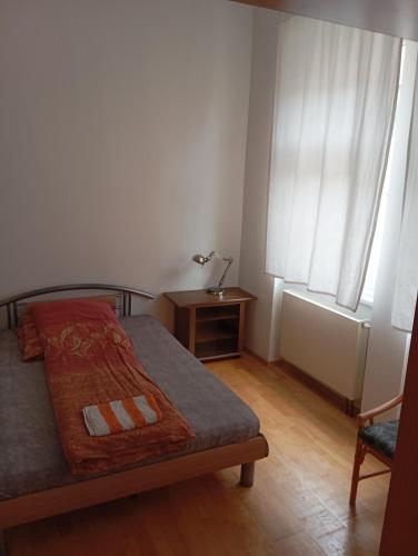 Ένα ή περισσότερα κρεβάτια σε δωμάτιο στο Ferienwohnungen Altstadt