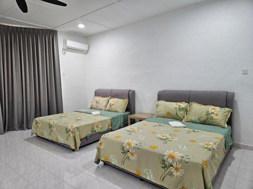 Ένα ή περισσότερα κρεβάτια σε δωμάτιο στο Leisure Homestay