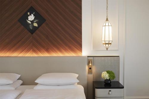 Katil atau katil-katil dalam bilik di Vier Jahreszeiten Kempinski München