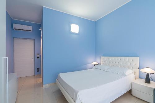 Ένα ή περισσότερα κρεβάτια σε δωμάτιο στο Villa Floyd Charming Rooms