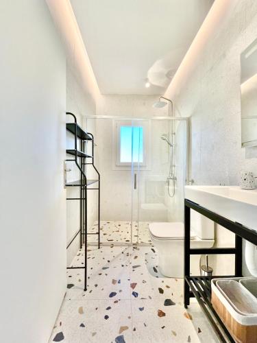 a bathroom with a toilet and a sink at Πράσινο σπιτάκι in Kastoria