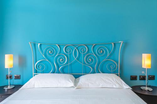 Ένα ή περισσότερα κρεβάτια σε δωμάτιο στο Villa Floyd Charming Rooms