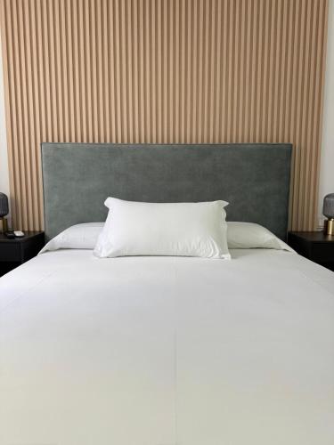 Ένα ή περισσότερα κρεβάτια σε δωμάτιο στο M&A Hostal