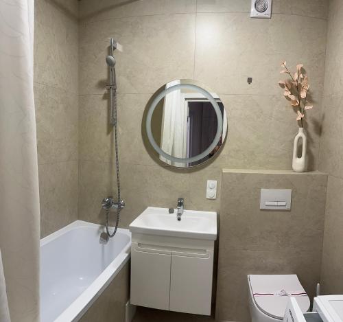 a bathroom with a sink and a mirror at Апартаменти Промінь ЖК яровиця Луцьк in Luts'k