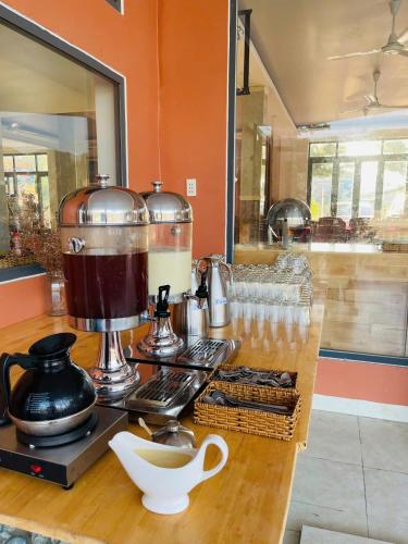 a coffee maker on a counter in a kitchen at Chau Gia Hotel in Vĩnh Hy