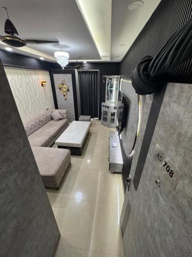a living room with a couch and a tv at A5 tower flat number 708 in Karnal