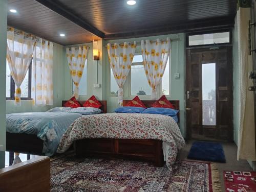 Ένα ή περισσότερα κρεβάτια σε δωμάτιο στο Grace Homestay
