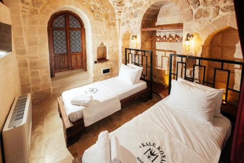 Katil atau katil-katil dalam bilik di Kale Konak Hotel