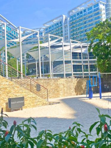 a large building with a staircase in front of it at Modern Rustic Home Staycation in Manila