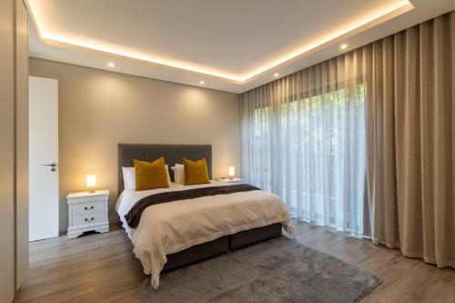 Postel nebo postele na pokoji v ubytování Thalia House