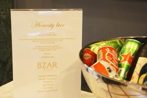 a menu for a bar with a bowl of sushi at Hotel Marisa in Rome