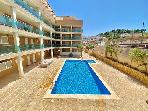 Modern apartment with pool close to the beach.