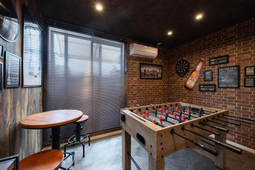 a room with a large chessboard in the corner at JAPAVISTA Enchant in Osaka
