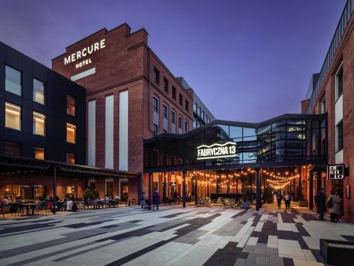 a rendering of a city street with buildings at Mercure Krakow Fabryczna City in Kraków