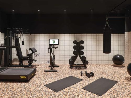 a gym with exercise equipment on the floor at Mama Shelter Roma in Rome
