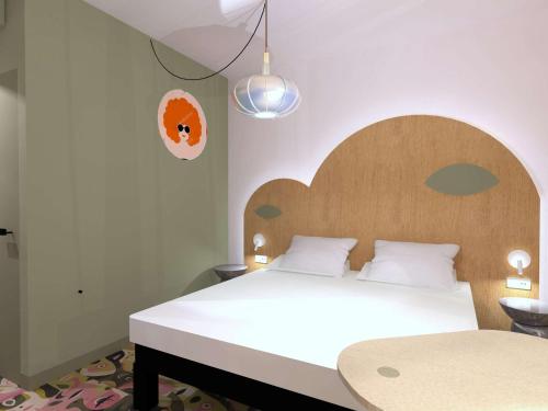 A bed or beds in a room at ibis Styles Metz Centre