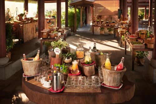 a table with bottles and glasses on top of it at L'Alya Ninh Van Bay in Ninh Van Bay