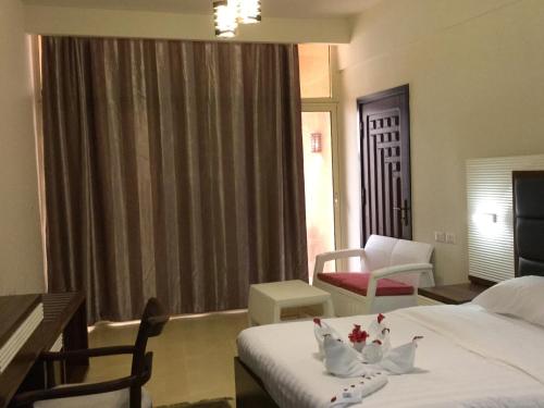 Postel nebo postele na pokoji v ubytování Jewel Inn Beni Suef