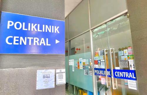 a sign that says polklinisk central in a store at AXON Residence Kuala Lumpur in Kuala Lumpur