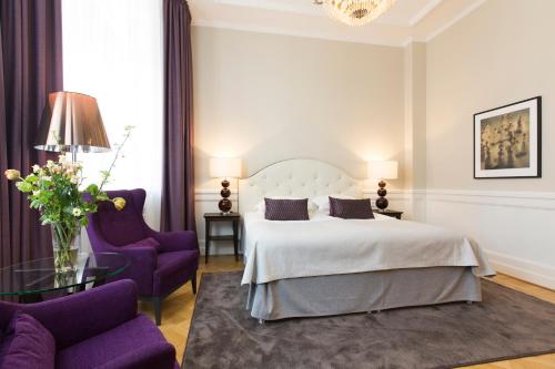 Postel nebo postele na pokoji v ubytování Elite Hotel Savoy