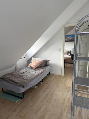 a bedroom with a bed in a room with stairs at Ferienwohnung Petra in Neumarkt in der Oberpfalz