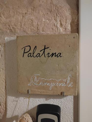 a sign that reads palatinate on a wall at Il Campanile Premium B&b in Altamura