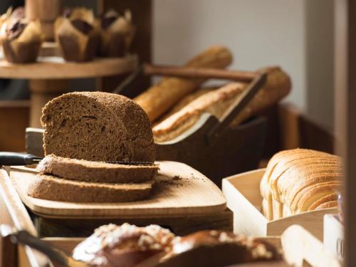 a loaf of bread sitting on top of a table at Novotel Cambridge North in Cambridge