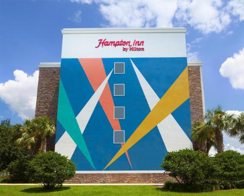 a large mural on the side of a building at Hampton Inn by Hilton Tampa Fairgrounds Casino in Tampa