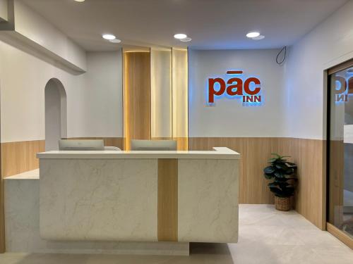an office with a mac firm sign on the wall at PACINN Narathiwat โรงแรมพักอินน์ นราธิวาส in Kampong Botong