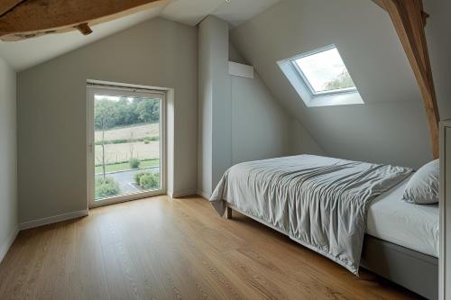 Voodi või voodid majutusasutuse Ferme de Pétrieux - Gîte "Le Chêne" avec piscine et wellness toas