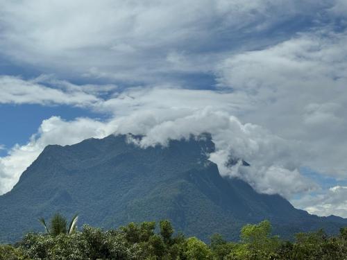 a view of a mountain with clouds in the sky at ม่อนหมอกเชียงดาว in Chiang Dao