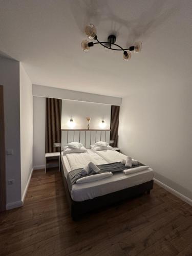 a bedroom with a large bed in a room at Casa David Valea Avrigului in Avrig
