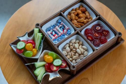 a wooden tray filled with different types of food at Lu Ming Beiyuan Xi'an Zhongdu Drum Tower City Wall Store in Xi'an
